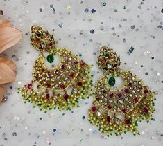 These gorgeous pair of earrings are made with 14k gold and is accented with high quality polki stones and pearls for the perfect statement look! The work is extremely beautiful with handcrafted stones and the colors are perfect to go with any outfit! Indian Bridal, Bridal Earrings, Stone, High Quality, Gold, Color