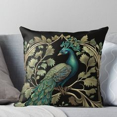 a peacock sitting on top of a tree filled with leaves and acorns throw pillow