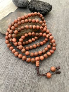 Unique and powerful Goldstone Japa mala Necklace from Nepal. A unisex piece that will be perfect for your day by day outfits and will be easy to match any other accessories. If it fits right can be a bracelet also. This is also a Buddhist praying 108 beads mala. The japa mala is 42.5cm- 16.75 inch long A unique addition to your jewelry collection. Enjoy Con salud Spiritual Beaded Bracelets For Rituals, Meditation Beaded Bracelets With Polished Beads, Polished Beads Bracelet For Meditation, Spiritual Brown Beaded Bracelets With Gemstone Beads, Spiritual Brown Gemstone Beaded Bracelets, Round Polished Beaded Bracelets For Meditation, Spiritual Hand-strung Beaded Necklaces For Rituals, Spiritual Beaded Mala For Festival, Adjustable Spiritual Beaded Necklaces For Rituals