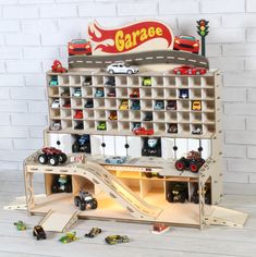 a toy car garage with cars and ramps