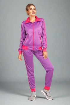 This women's 2-piece tracksuit features a comfortable track material suitable for any age and all sorts of casual and sports activities. Tracksuits have always been in mainstream fashion trends and the elegant color combinations has made this 2-piece tracksuit a top choice for every day activewear. Many traditional outlets do carry trimmed jogger track pants with full zip up track jackets but not many carry a matching 2-piece jogging outfit. This matching 2-piece jogging outfit is available in r Jogging Outfit, Joggers Track Pants, Jogging Suit, Tracksuit Women, Fashion Joggers, Track Jackets, Track Pants, Designer Collection, Color Combinations