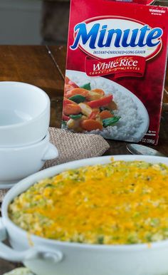 a box of minute white rice next to a bowl of food on a table