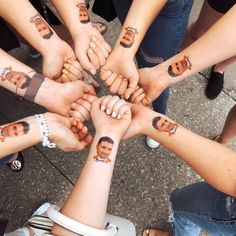 a group of people with their hands together