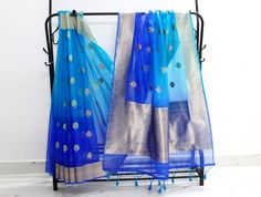 "Welcome to SabirCreations  Blue color fancy tissue fabric saree with banaras un-stitch blouse. saree. Enjoy a free gift with any purchase of sarees. Saree Details : 🔵LENGTH: 5.5 meters 🔵WIDTH: 1.10meters 🔵MATERIAL: poly organza tissue fabric, border,banaras blouse fabric 🔵COLOR: Blue shades (As a picture) 🔵 Saree pico and fall stitching were completed. 🔵 Occasion: casual, ceremonial, festival, party, wedding 🔵 style: designer, traditional WITH UNSTITCHED BLOUSE . NOTE: 🌼👉saree comes with an un-stitched blouse material. ( If you would like me to stitch the blouse for you with your custom measurements, please send me a message) 🌼👉 There might be slight variations in the color. (variation because of, under what light and which camera settings are used). 🌼👉If you have any questio Blue Dola Silk Pre-draped Saree With Sheer Dupatta, Blue Tissue Silk Saree For Party, Blue Saree With Dupatta For Diwali, Blue Pre-draped Saree With Self Design In Dola Silk, Party Saree With Zari Weaving For Eid, Eid Party Saree With Zari Weaving, Diwali Celebration Tissue Silk Saree, Blue Traditional Wear With Unstitched Blouse For Celebration, Blue Dola Silk Saree With Sheer Dupatta