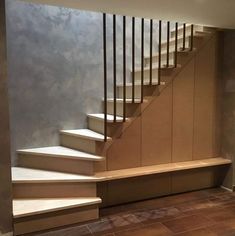 a living room filled with furniture and a stair case