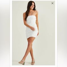 Mini Is The Perfect Statement Dress To For Any Occasion. The Star Of The Show Of This Dress Is The Beautiful 3d Floral Embellishments All Over The Dress. Fit: Fitted, Mini Closure: Zipper Material: 100% Polyester Strapless White Sequined Bodycon Dress For Spring, White Glamorous Bodycon Dress, Glamorous White Bodycon Dress, White Mini Sequin Dress For Summer, Fitted White Strapless Sequin Dress, Elegant White Sequin Dress For Date Night, White Mini Sequin Dress For Spring, White Mini Sequin Dress For Date Night, White Sequin Mini Dress For Date Night