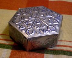 a silver box sitting on top of a table