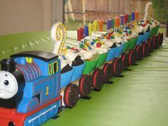 a thomas the train birthday cake with candles