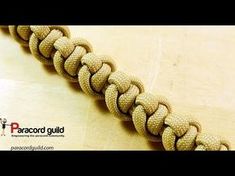 a close up of a paracord bracelet on a table