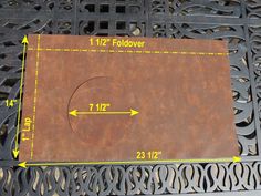 a metal grate with measurements for the hole in it