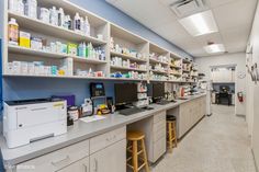 a pharmacy room filled with lots of medical supplies and equipment on the shelves next to each other