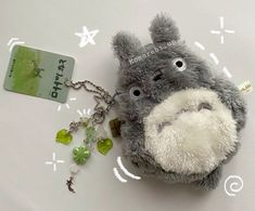 a stuffed animal keychain with a credit card attached to it