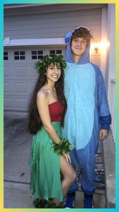 a man and woman dressed in costumes standing next to each other