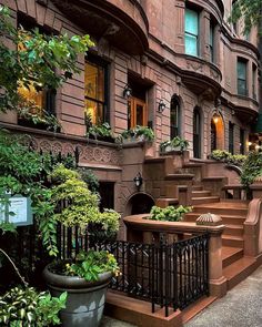 the stairs lead up to an apartment building