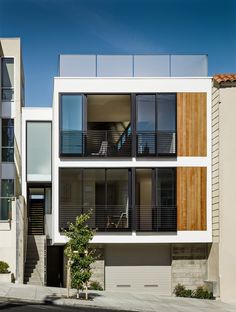 an apartment building with multiple balconies and windows