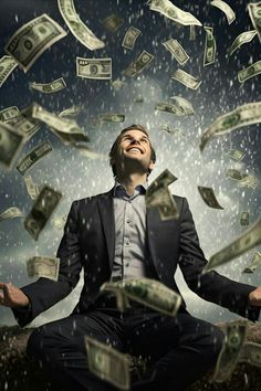 a man sitting in the air surrounded by money