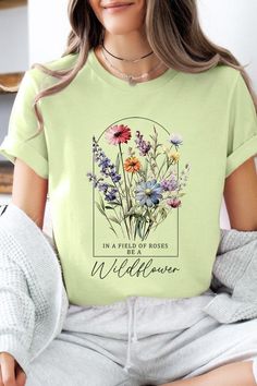 Field of Roses Be A Wildflower Floral Meadow Graphic T Shirts.Unisex Crew Neck Short Sleeve Tees.Crafted from premium materials, tailored to your lifestyle, ensuring a comfortable fit for any occasion.Family Group Uniforms Birthday Party Gift Concert Festival Events.High Quality Direct To Film Printed Graphic Design.100%COTTON,HEATHER(52%COTTON,48%POLY),ATH.HEATHER,BLACK HEATHER(90%COTTON,10%POLY)NICARAGUAMade In: Nicaragua Spring Floral Print Graphic Tee Shirt, Relaxed Fit Floral Graphic Tee, Vintage White T-shirt With Floral Print, Multicolor Floral Print Graphic Tee, Botanical Style Flower Graphic T-shirt, Film Prints, Birthday Party Gift, Spring Shirts, Graphic Design Print