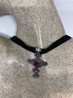 Vintage Pink Raw Ruby Choker Pendant Necklace Brilliant dark Red ruby Lovely handmade silver work Low content silver NOT 925 Sterling Silver Over an inch long All jewelry is shipped free in the US in a nice gift box. Check out our over a THOUSAND great reviews Gothic Cross Jewelry As Gift, Gothic Cross Jewelry Gift, Gothic Cross Jewelry For Gifts, Gothic Sterling Silver Choker Jewelry, Gothic Sterling Silver Choker, Red Sterling Silver Cross Necklace, Red Cross Necklace In Sterling Silver, Gothic Necklace With Oxidized Finish As Gift, Gothic Oxidized Necklace As Gift