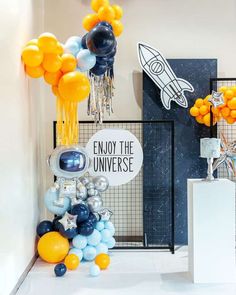 an astronaut themed party with balloons and decorations