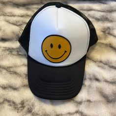 Black & White Smiley Face Trucker Hat Yellow/Gold Smile On Front Mesh/Trucker Adjustable *Never Worn* Black Trucker Hat For Spring Beach, Spring Beach Black Trucker Hat, Trendy Black Trucker Hat, Fun Black Hat, One Size Fits Most, Fun Black Hat One Size, Fun Black Hat One Size Fits Most, Casual Black Trucker Hat For Spring, Fun Black Trucker Hat With Curved Brim, Black Brimmed Trucker Hat For Spring