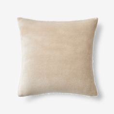 a beige pillow on a white background