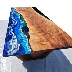 a wooden table with blue and white designs on it