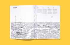 an open book showing the layout of london and its surrounding streets, with yellow background