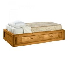 a bed with two drawers underneath it and a white blanket on top of the bed