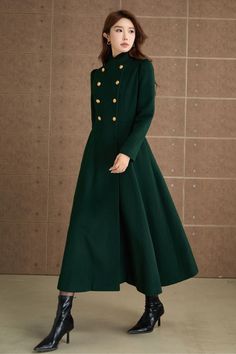 Step out in style with this luxurious green wool coat, perfect for adding a touch of sophistication to your winter wardrobe. The high neckline and long sleeves provide warmth, while the double-breasted gold buttons add a chic, vintage-inspired touch. The deep, rich green color makes it a versatile piece that can be dressed up or down for any occasion. DETAIL * 50% wool blend, 50% fiber,nylon * Lapel  collar coat * Long sleeves coat * Double breasted coat * Two side pockets * Fitted waist * Fit&flare coat * Mid calf length * Suit for winter and autumn * Dry clean MODEL SIZE Bust 85 cm(33.4") Waist 67 cm(26.7") Height 168cm (5' 6") She wears size XS Choose CUSTOM Order if you * Need a better fit * Can't find your size in our size Chart * Change the Style * Chang the Length * Your Height is n Elegant Wool Coat For Office In Solid Color, Elegant Long Wool Coat Solid Color, Elegant Long Wool Coat In Solid Color, Elegant Double-breasted Wool Coat, Elegant Green Outerwear With Stand Collar, Elegant Green Stand Collar Outerwear, Green Long Wool Coat For Winter, Green Long Wool Winter Coat, Green Double-breasted Wool Coat For Fall