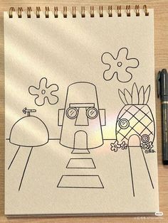 a drawing of a robot and pineapple on a piece of paper with a pen next to it