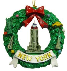 a christmas ornament hanging from the side of a building that says new york