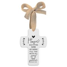 a wooden cross with a ribbon hanging from it's end and the words hope on it