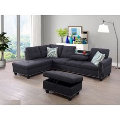 a living room scene with focus on the couch and ottoman