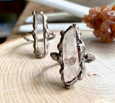 *Usually ships same day or next day and arrives ready for gifting in a cute boho gift box. Make a statement with these gorgeous and rustic raw gemstone rings. Rough quartz crystals in beautiful freeform shapes are electroplated in bronze in these non-adjustable rings. I have two sizes so please choose from the drop down menu. *Stones vary in size slightly as these are all natural and unique stones. *Stones range in size between 1" and 1.5" , each are 100% unique. Please expect variations in size Copper Electroformed Jewelry, Raw Amethyst Ring, Rough Quartz, Raw Stone Earring, Raw Stone Jewelry, Raw Crystal Ring, Raw Gemstone Ring, Raw Quartz Crystal, Raw Stone Ring