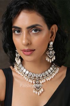 Get your hands on the Victorian Polki necklace set embedded with polki and shell pearls is here to accentuate your feminine grace. The Victorian necklace with pretty drop earrings is here to bejewel your neckline that is beautifully handcrafted by the artisans of India. Spruce up your look with our magnificent polki and pearls necklace paired with quintessential earrings  Necklace Closure - Adjustable Dori Earrings Closure - Push-Back Style Tip - Created out of our fascination with radiance, bling, and luxury. These designs embody the luminosity of the heavens, paired with contemporary hues and loads of luxury. You'll see the unusual play of textures and hues, some soulful pairing of contrasts, like gold and silver, and dreamy details that will offer much versatility. We would love to see Silver Pearl Necklace With Meenakari, Silver Meenakari Pearl Jewelry Sets, Silver Pearl Jewelry Set With Meenakari Detail, Silver Meenakari Jewelry Sets With Pearls, Silver Pearl Jewelry Set With Meenakari, Silver Kundan Necklace With Pearl Drop, Pearl Kundan Necklace With Silver Meenakari, Silver Kundan Pearl Necklace For Diwali, Silver Pearl Jewelry With Meenakari