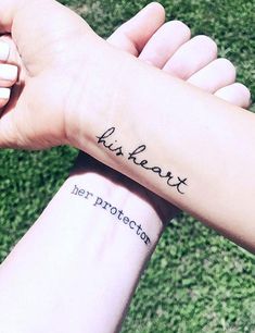 two hands holding each other with tattoos on their arms that say, just heart her protection