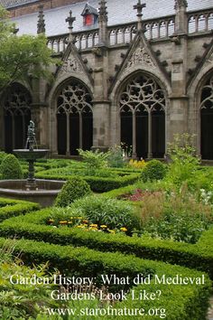 the garden is surrounded by hedges and trees