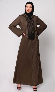 Elevate your modest fashion with our Hoodie Abaya, where contemporary style meets traditional elegance. Crafted from high-quality fabric, this abaya features intricate check embroidery, adding a touch of sophistication. The front is adorned with charming tassels that sway gracefully with your movements, creating a dynamic silhouette. Designed for both comfort and style, it includes two practical pockets, perfect for keeping essentials close at hand. Whether worn casually or for special occasions Hoodie Abaya, Abaya With Pockets, Check Embroidery, Brown Hoodie, Modest Fashion, Black Hoodie, Contemporary Style, Quality Fabric, Tassels