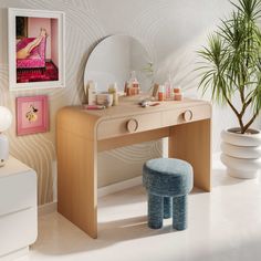 a vanity table with a stool and mirror in a room next to a potted plant