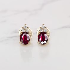 Why we love it:These high quality and classic stud earrings feature rich red oval shape rubies paired with clusters of vibrant diamonds.Highlights:- 1.20ctw rubies- Fantastic quality, very rich true red color and a lively play of light!- Bright white and eye clean diamond accents- High quality 18k yellow gold settings and jumbo backsDimensions:9.4 x 4.2mm.Additional Notes:We have a matching necklace available as well with the sku number 19725-19723 Antique Engagement Rings Vintage, Edwardian Style, Light Bright, Yellow Gold Setting, True Red, Ruby Diamond, Fine Jewellery Earrings, Matching Necklaces, Vintage Engagement Rings