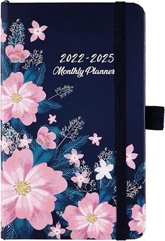 a blue and pink planner with flowers on it