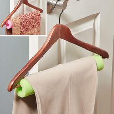 the clothes hanger is holding two towels on it's hooks, and there are pictures of what appears to be drying