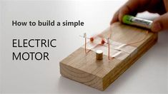 an electric motor is being worked on by someone using a small device to make it easier for