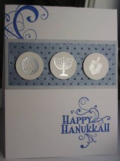 a happy hanukkah greeting card with two menoras on the front