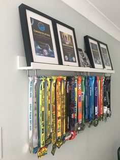 a row of medals hanging on a wall