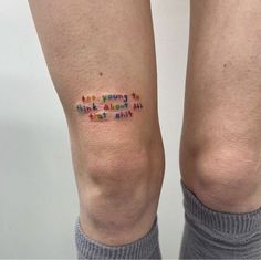 a woman's legs with words written on them and the bottom part of her leg