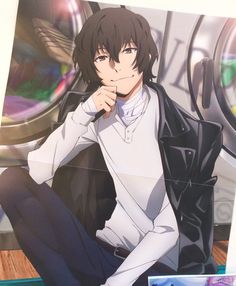 an anime character sitting on the floor with his hand under his chin