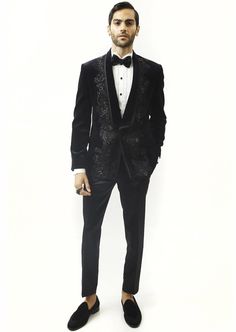 Astrum handcrafted tuxedo is highlighted with metallic threads. Single-buttoned satin detail shawl collar. This creation in velvet can be tempered with flat-front trousers for a reception look. Elegant Tuxedo For Black-tie Festive Events, Elegant Tuxedo For Gala And Festive Occasions, Long Sleeve Tuxedo For Black-tie And Festive Events, Festive Tuxedo For Black-tie Events, Festive Long Sleeve Tuxedo For Black-tie Events, Luxury Festive Tuxedo For Gala, Luxury Evening Suits For Festive Occasions, Luxury Festive Evening Suits, Tailored Tuxedo For Gala Festivities