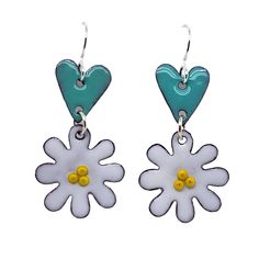 Elevate your everyday style with our whimsical Daisy Heart Earrings! These delicate and meticulously handcrafted earrings feature daisy motifs hanging below heart shapes, creating a charming and playful design. 🌼 Artistry in Every Detail: Each earring is a work of art, carefully made with attention to detail. The daisies come to life with yellow centers, and the heart-shaped design adds a touch of romance. 💫 Versatile Elegance: These earrings are perfect for any occasion, from casual brunches Whimsical Flower Charm Earrings For Gift, Whimsical Dangle Earrings With Flower Charm, White Whimsical Spring Earrings, Whimsical Flower Shaped Earrings Gift, Whimsical White Spring Earrings, Whimsical White Earrings For Spring, Whimsical Spring Earrings With Flower Charm, Whimsical Flower Charm Earrings, Whimsical Dangle Flower Earrings