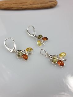 Baltic Amber set. Sterling silver 925 with hallmarks. Multi colour Amber. Nice and not to big set. Earrings length 3.3 cm pendant length 2,2 cm. Free gift when you buy a pendant or a set - silver plated chain. Same model Available in brown colour also. All parts are sterling silver 925. More earrings: https://www.etsy.com/shop/AmberLithuania?ref=simple-shop-header-name&listing_id=780205095&section_id=27948198 This item was made of natural Baltic Amber. All the amber used in my jewelry is collect Baltic Amber Necklace, Baltic Amber Jewelry, Set Earrings, Amber Pendant, Amber Earrings, Amber Bracelet, Amber Necklace, Brown Colour, Amber Jewelry